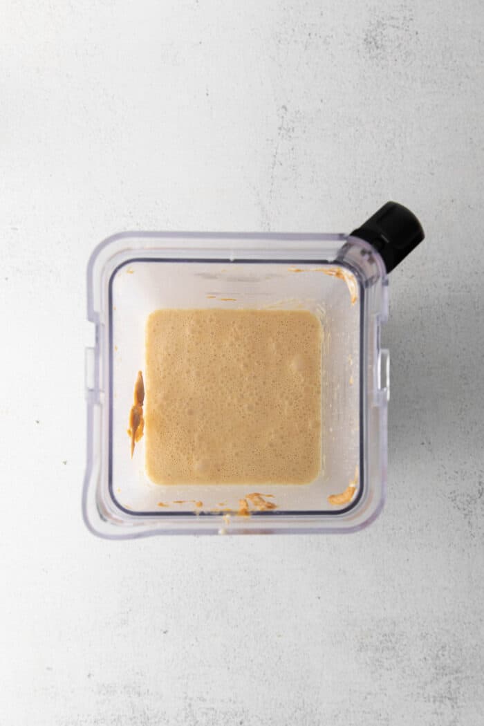Made with just 5 ingredients and an ice cream maker, this Homemade Peanut Butter Ice Cream is sweet, creamy, and easy to make. Peanut butter ice cream ingredients in a blender