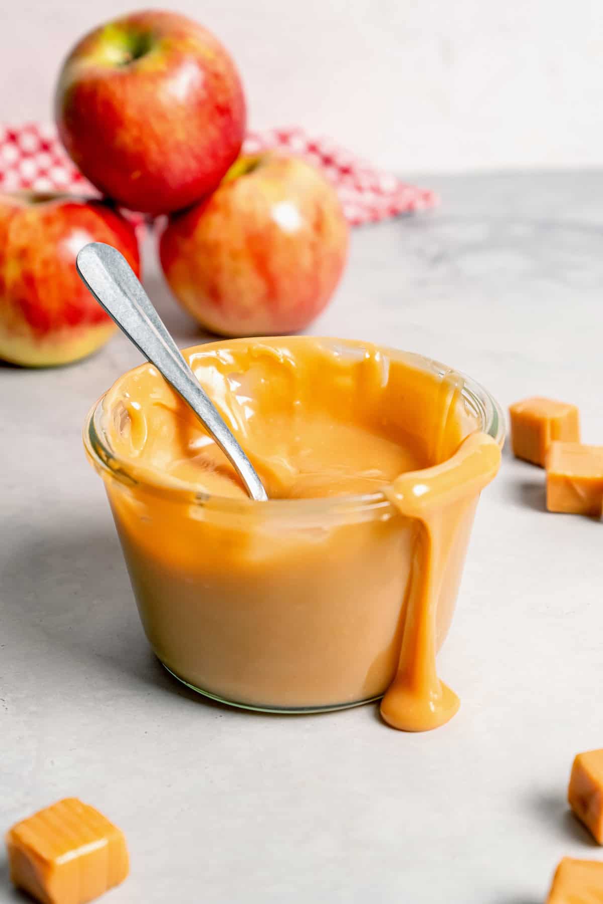 This Caramel Apple Dip beats the pants off of any store-bought caramel dips. Guaranteed! It’s also super easy to make with 3 ingredients. Spoon in jar of caramel apple dip