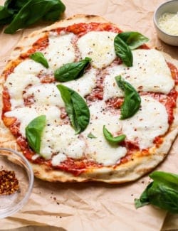 Grilled pizza with fresh mozzarella and basil.