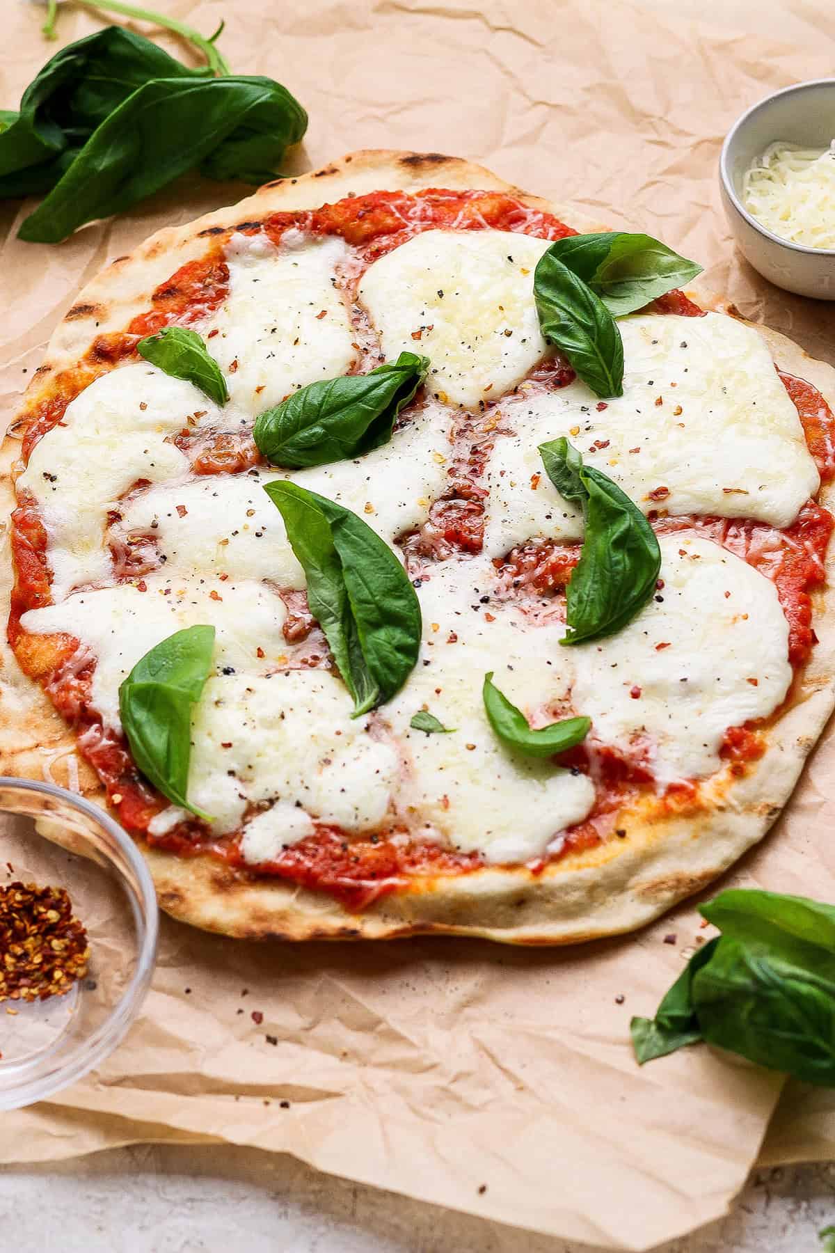 Grilled pizza with fresh mozzarella and basil.