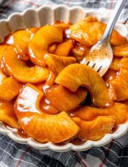 Fork in bowl of sautéed apples