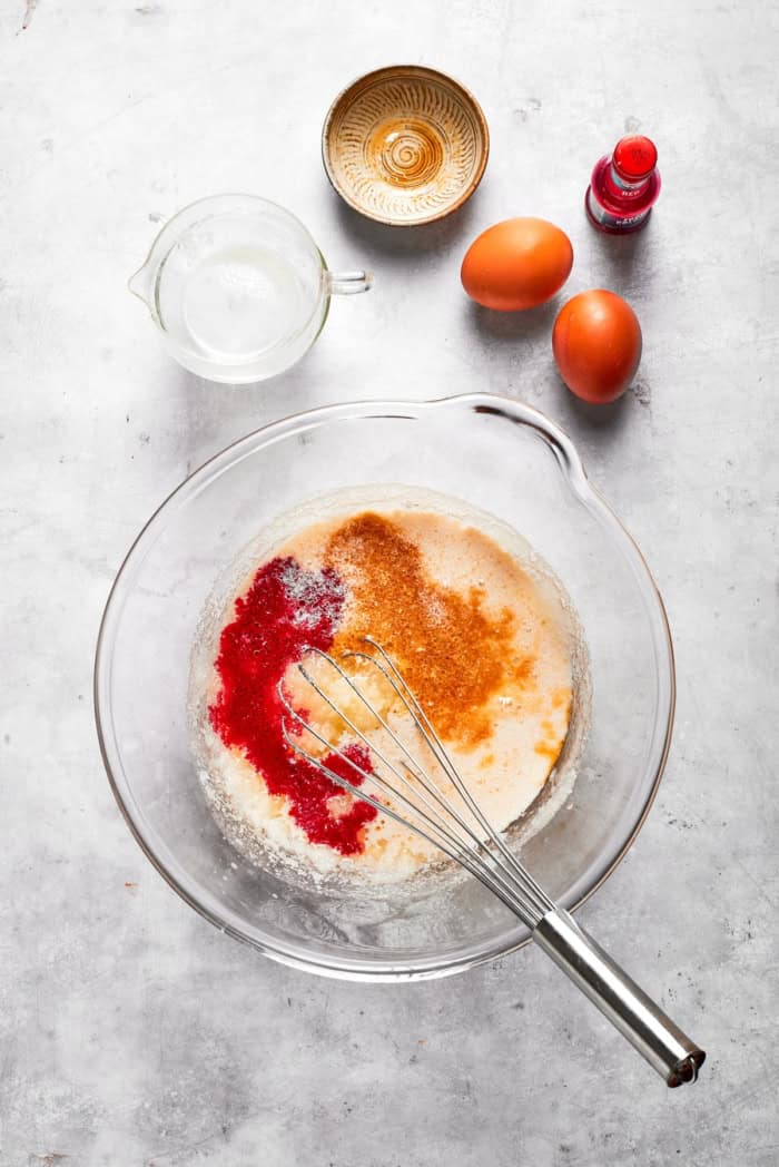 Whisk in bowl with wet ingredients for red velvet cake