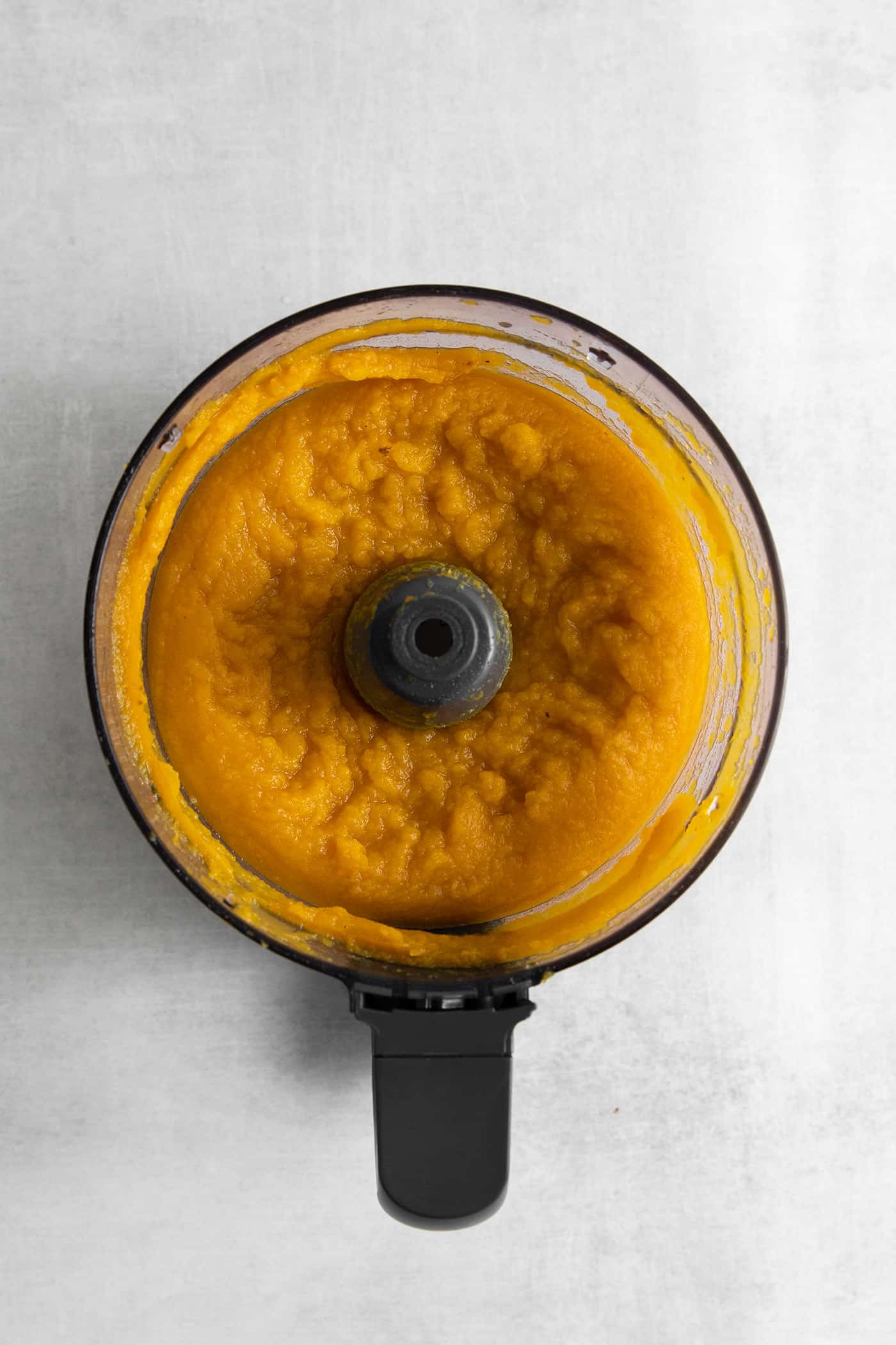 This Creamy Squash Soup with Cranberry Relish is made with squash, cream, warm spices and finished with a tart cranberry topping. Squash pureed in a food processor