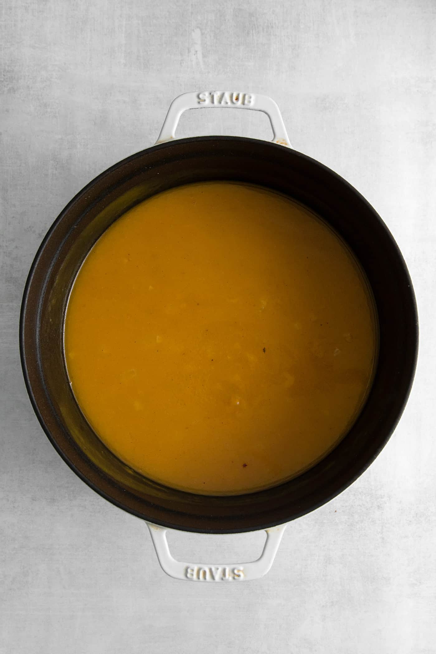 This Creamy Squash Soup with Cranberry Relish is made with squash, cream, warm spices and finished with a tart cranberry topping. Squash in a soup pot