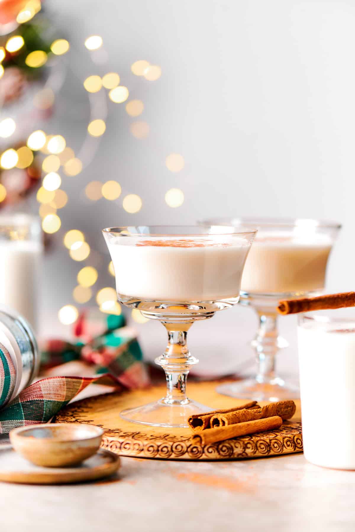 This vanilla steamer recipe combines warm milk with cinnamon, vanilla and almond extract for a cozy drink to savor all winter long. Vanilla steamers in glasses with cinnamon garnish