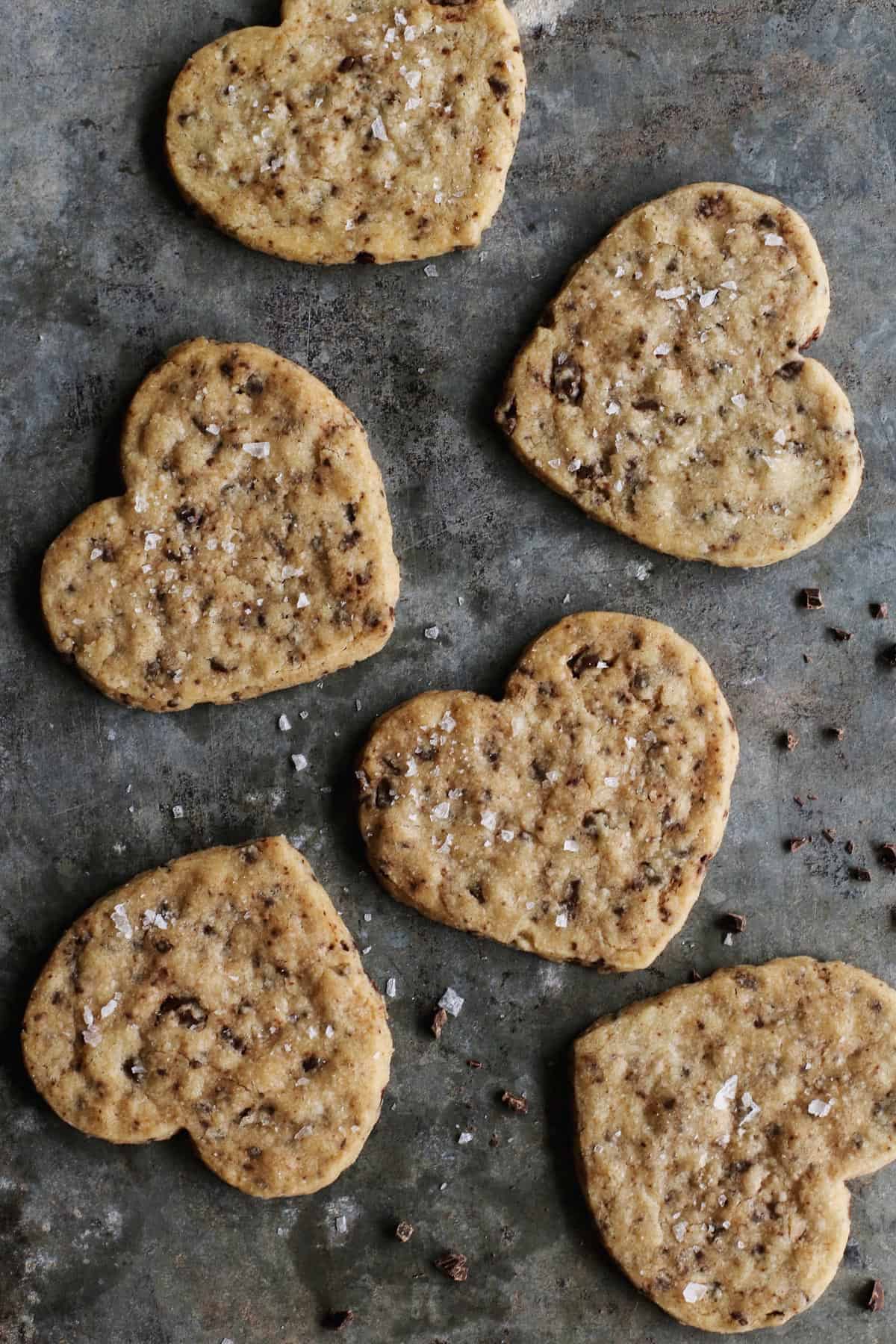These delicate Chocolate Chip Shortbread Cookies are buttery, crisp, and flecked with bittersweet chopped chocolate. shortbread cookies in the shape of hearts