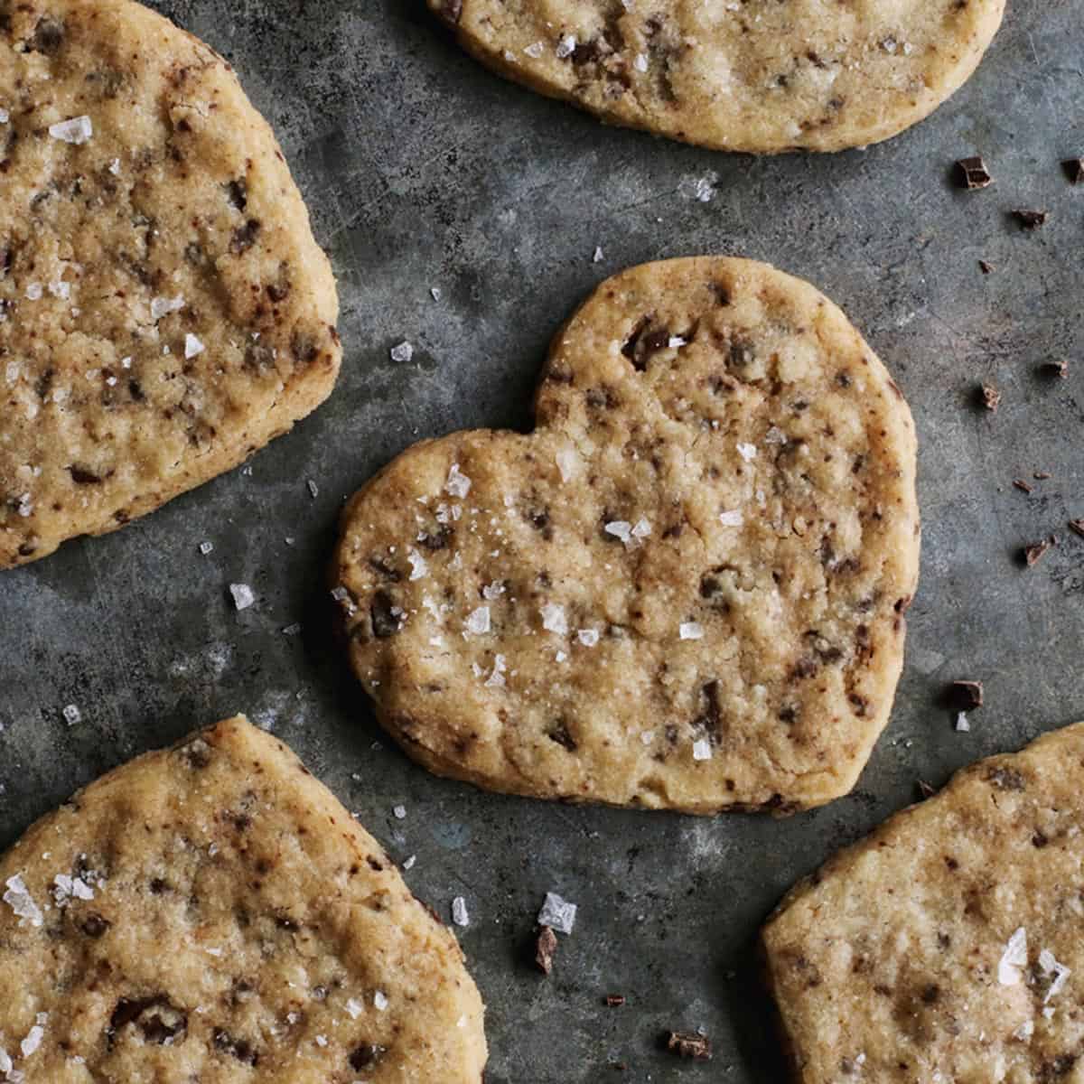 These delicate Chocolate Chip Shortbread Cookies are buttery, crisp, and flecked with bittersweet chopped chocolate. heart-shaped Shortbread Cookies