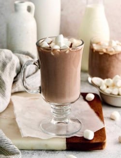 Homemade hot chocolate in glass mug with marshmallows