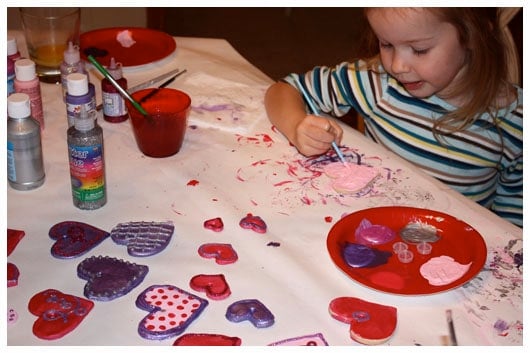 a girl painting ornaments