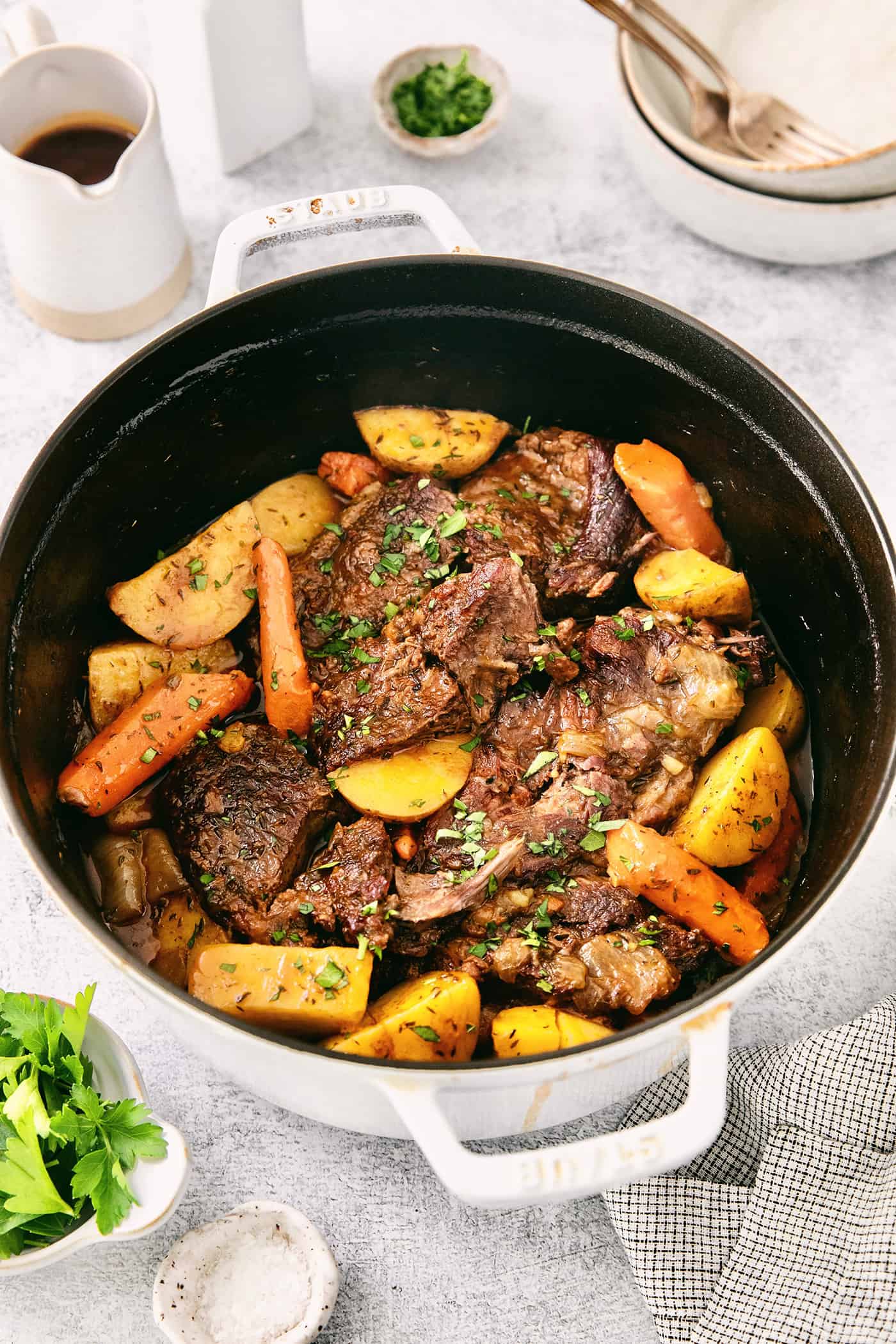 Made with chuck roast, potatoes, carrots, and onions in a beef broth, this Classic Pot Roast is comfort food at its finest. Hearty & filling! Chuck roast with vegetables in a pot