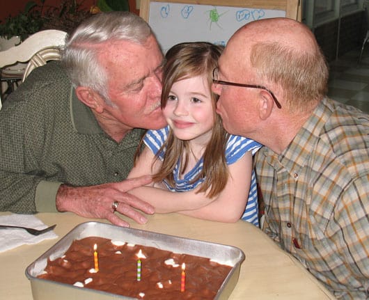 a girl and her two grandpas