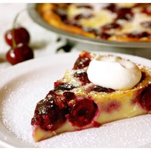 This slice of cherry clafouti with whipped cream is one of the best French dessert recipes ever.