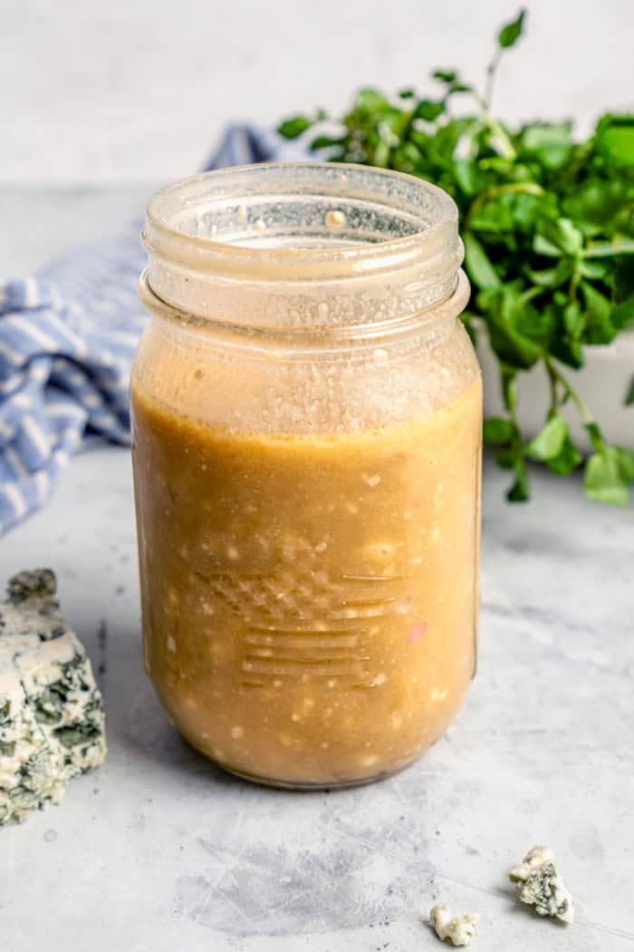 With smoky red potatoes and a rich blue cheese vinaigrette, this grilled potato salad recipe is so delicious, it might just steal the show! Jar of blue cheese vinaigrette