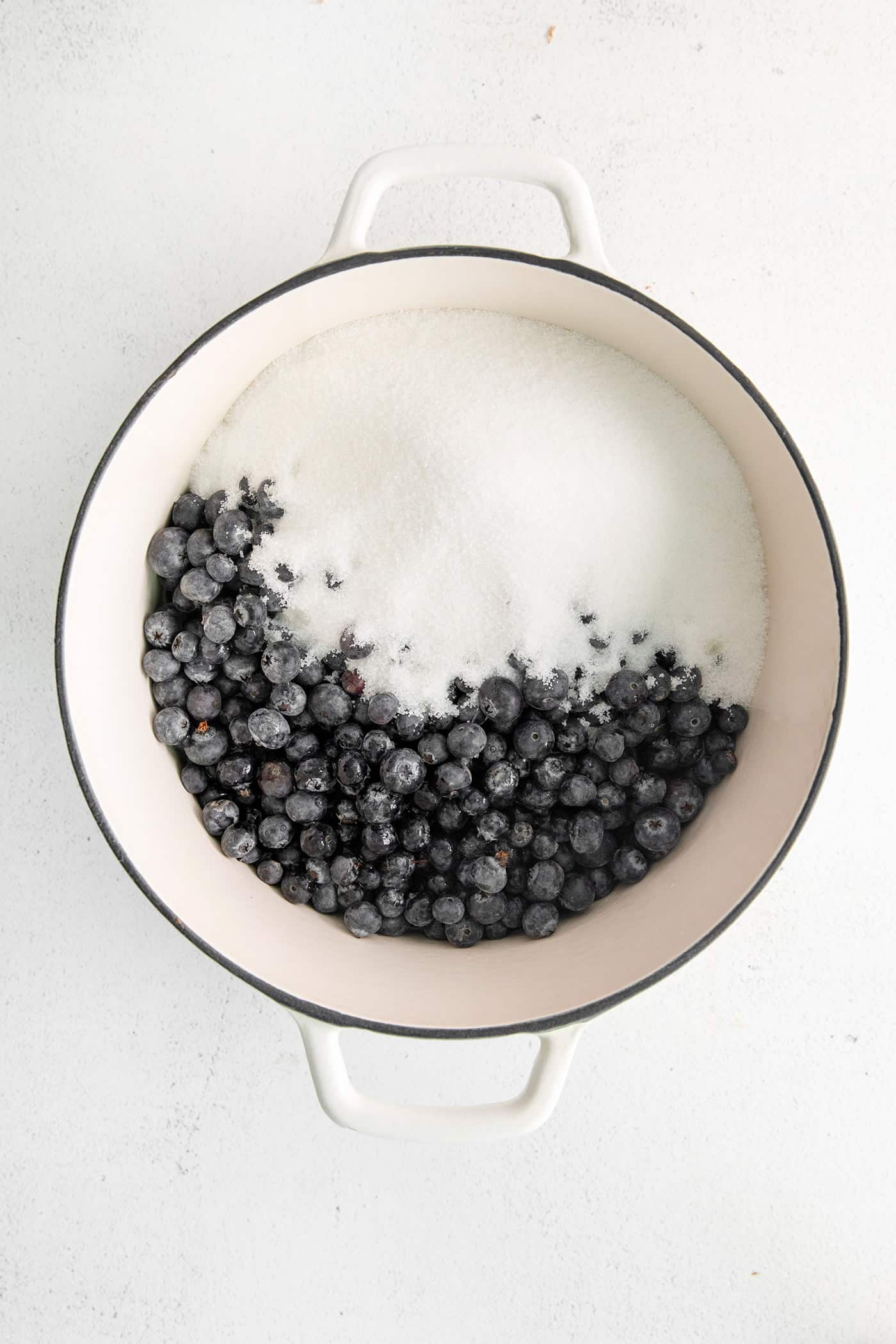 Made with just 4 ingredients, this Homemade Blueberry Jam with Mint is dark and fruity, with a sweet but cool and refreshing flavor. Blueberries and sugar in a pot