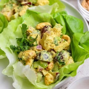 Closeup of curry chicken salad in lettuce leaf