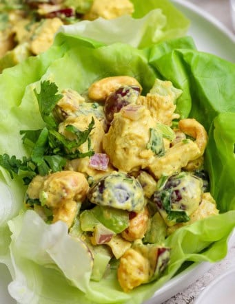 Closeup of curry chicken salad in lettuce leaf