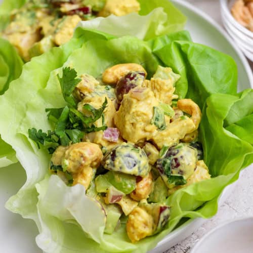 Closeup of curry chicken salad in lettuce leaf