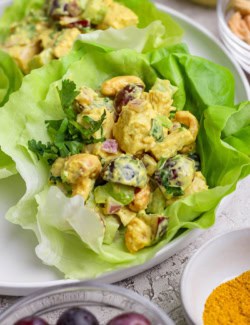 Curry chicken salad in lettuce cups on plate