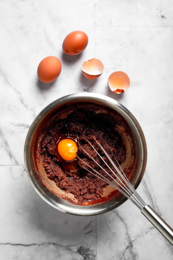 These Red Velvet Brownies are dense and fudgy, exceptionally moist, and fantastically rich. The cream cheese frosting on top is perfection! Whisking eggs into brownie batter