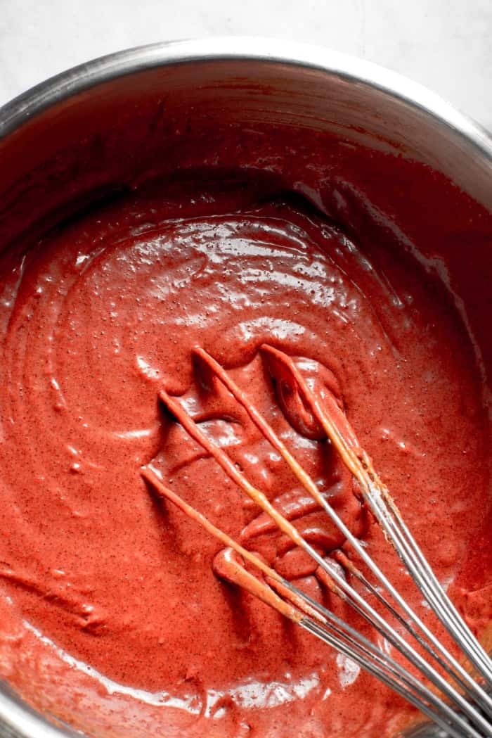 Brownie batter in bowl with whisk