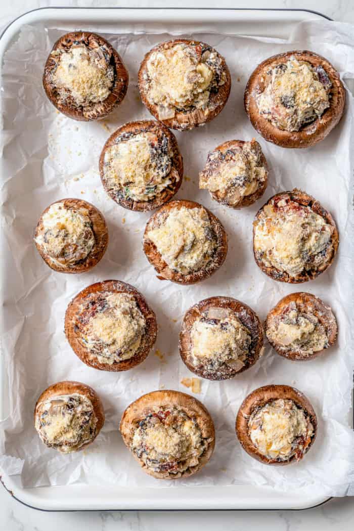 Overhead view of mushrooms stuffed with blue cheese and bacon filling