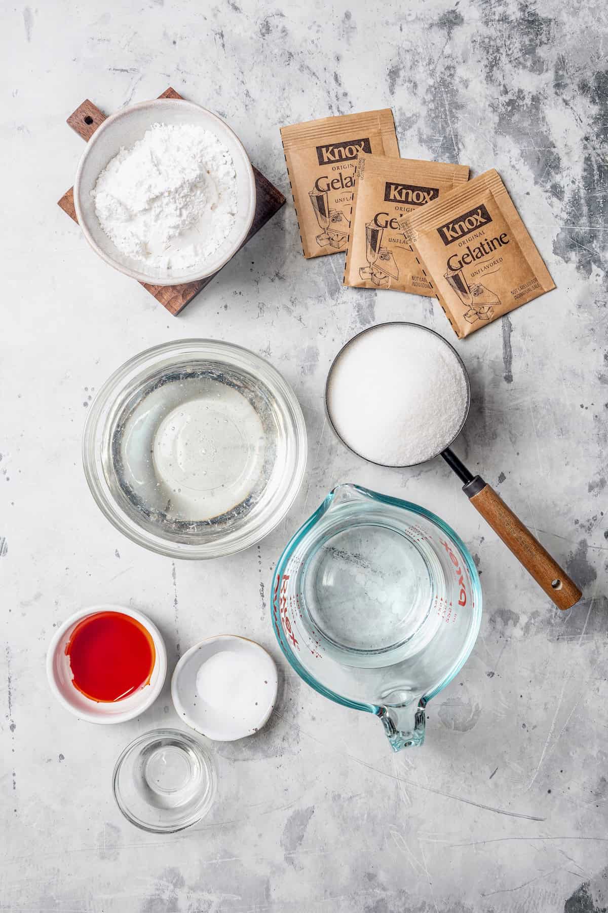 Homemade Marshmallow Hearts are the very best way to send a little love on Valentine’s Day — or any time of year. Fluffy, puffy, and sweet! Overhead view of ingredients for marshmallow hearts
