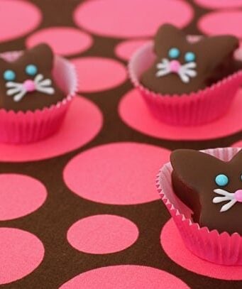 Chocolate dipped marshmallow bunnies in baking cups