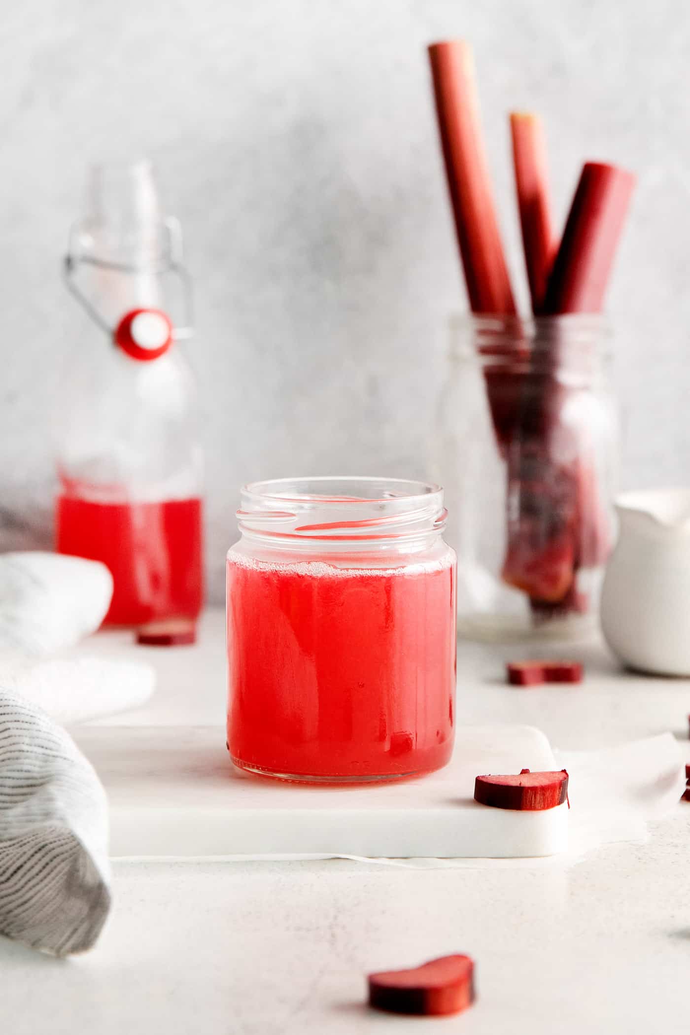 With a sweet-tart flavor, Ruby Rhubarb Syrup is just the thing for the best cocktails and mocktails, not to mention as a topping for pancakes and desserts! a small jar of rhubarb syrup
