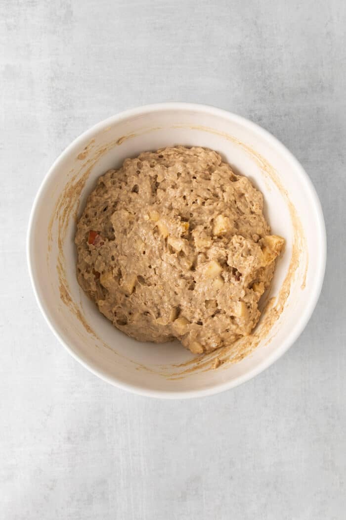 Studded with bits of apple and oats, these Apple Oatmeal Pancakes are a cozy, comforting breakfast that's hearty yet not heavy. Apple oat pancake mix in a bowl