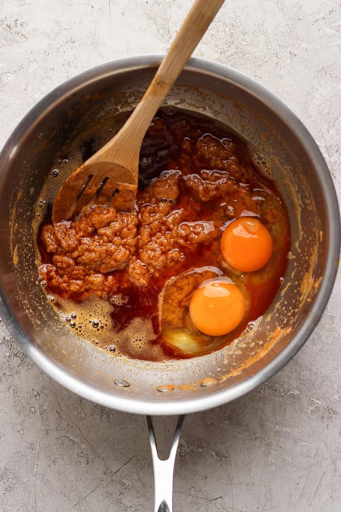 Stirring eggs and other liquid ingredients into melted butter and butterscotch