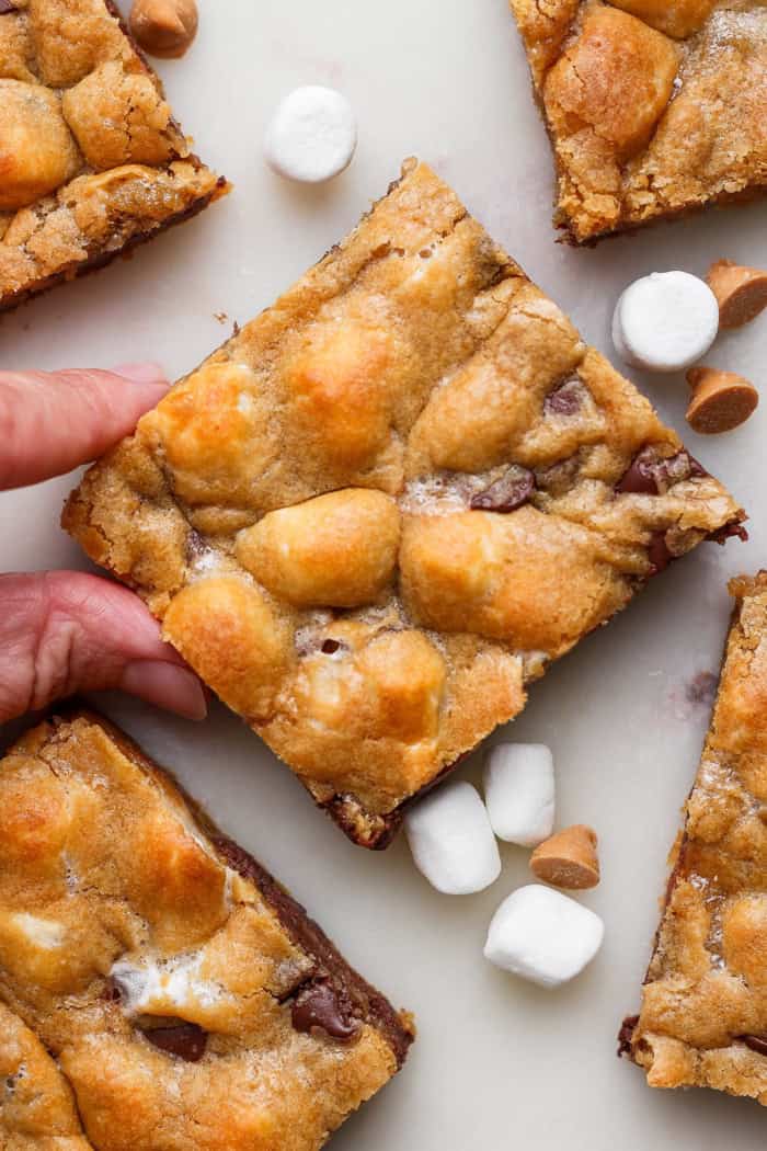 Hand grabbing disappearing marshmallow brownie