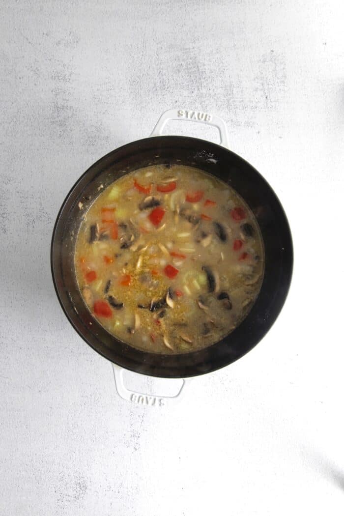 Make this easy Smoked Turkey Chowder recipe in one pot. It's lightly creamy and loaded with flavor, a great way to use up turkey leftovers! Vegetables and bacon with broth and half and half in a pot