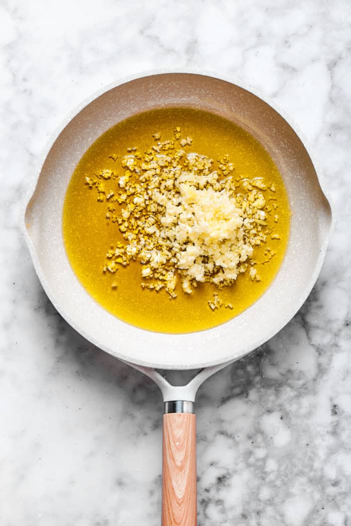 This Bagna Cauda dip is packed full of garlic and anchovies for big flavor — and it's loads of fun to eat! Easy to make in just 30 minutes! Garlic added to pan of olive oil