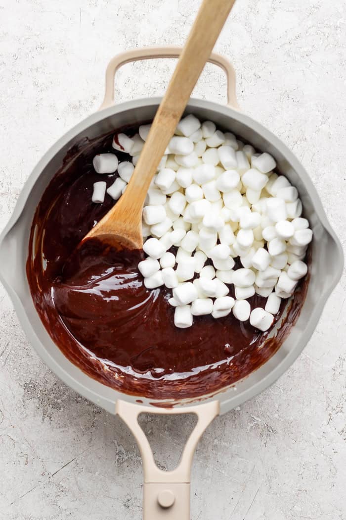 A secret ingredient makes this easy Chocolate Fondue the best ever! It’s rich, decadent and thick enough to stick to all your dippers. Stirring marshmallows into chocolate fondue