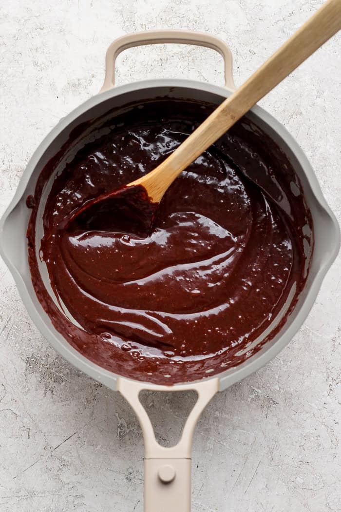 A secret ingredient makes this easy Chocolate Fondue the best ever! It’s rich, decadent and thick enough to stick to all your dippers. Overhead view of chocolate fondue in saucepan