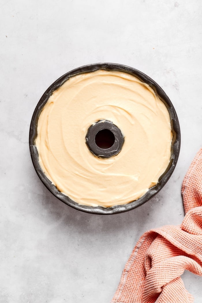 This cream cheese pound cake is a simple 6-ingredient recipe that’s rich, buttery, and perfectly dense with a velvety crumb. The best! Batter for cream cheese pound cake in Bundt pan.