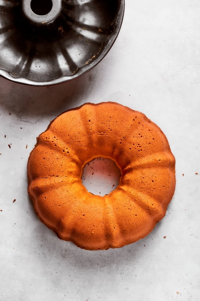 This cream cheese pound cake is a simple 6-ingredient recipe that’s rich, buttery, and perfectly dense with a velvety crumb. The best! Cream cheese pound cake removed from pan.