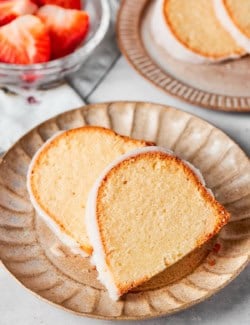 Two slices of cream cheese pound cake on plate.