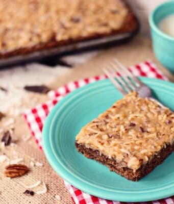 a slice of German chocolate sheet cake on a blue plate