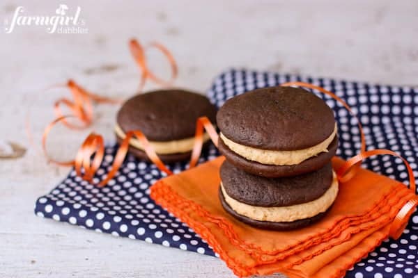 Whoopie Pies with Fluffy Peanut Butter Marshmallow Cream are the ultimate cake sandwich! It doesn't get much better than this classic peanut butter and chocolate combination. Three whoopie pies with peanut butter marshmallow filling.