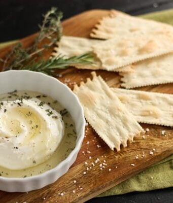 a dish of ricotta sprinkled with herbs