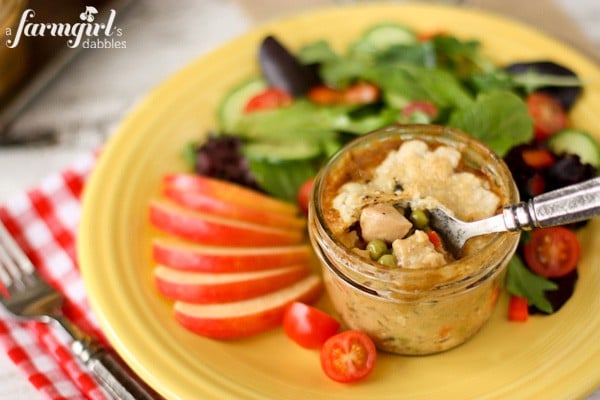 individual chicken pot pie on a yellow plate