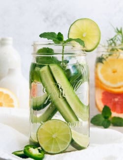 Large jar of spa water with cucumber, mint, and lime
