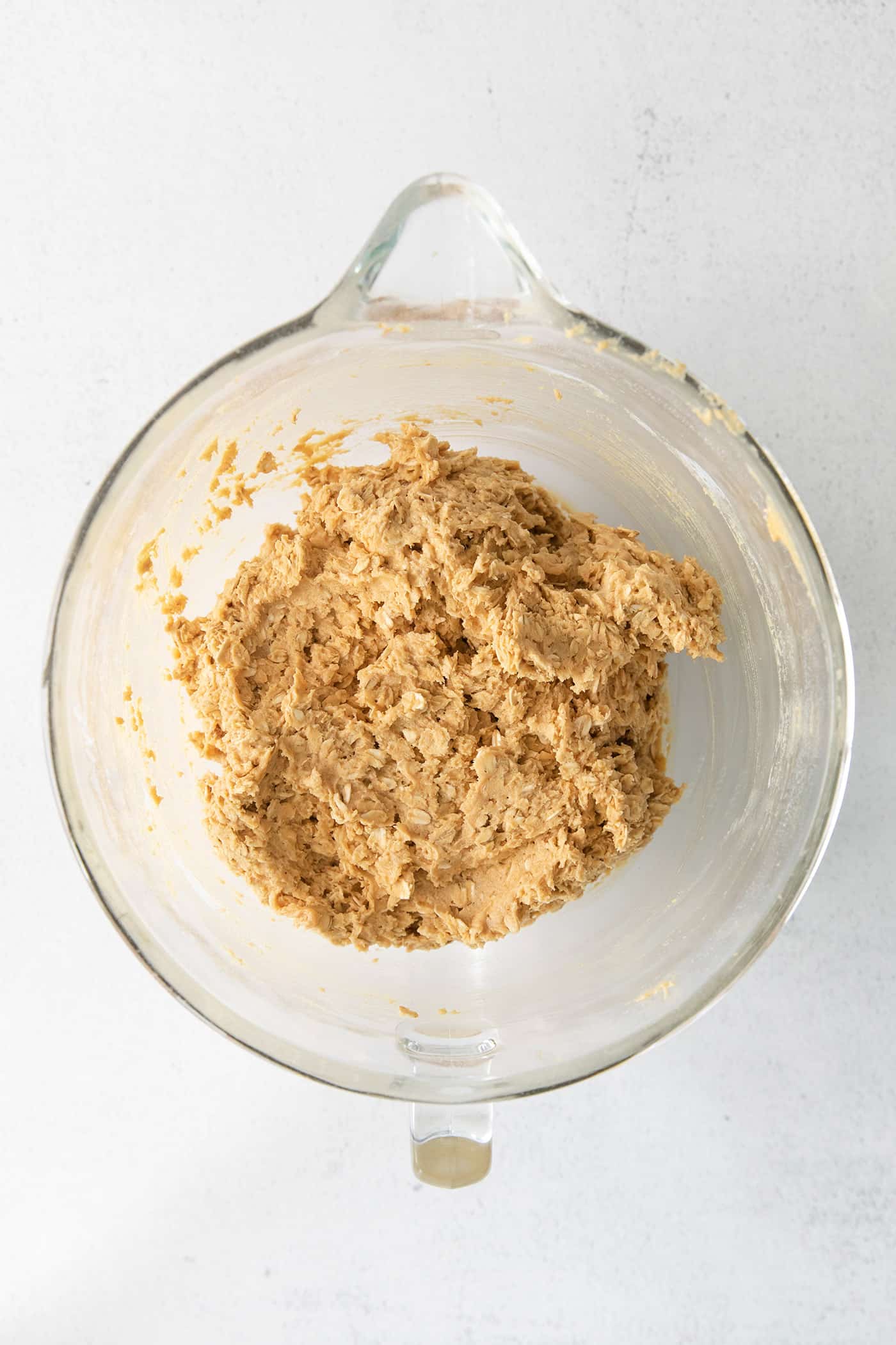Peanut butter oatmeal cookie dough in a mixing bowl