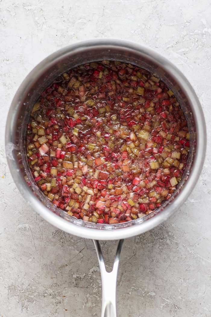 With the right balance of sweet and tart, this strawberry rhubarb freezer jam is a delight — and you don't need canning equipment to make it! Overhead view of cooked rhubarb for jam