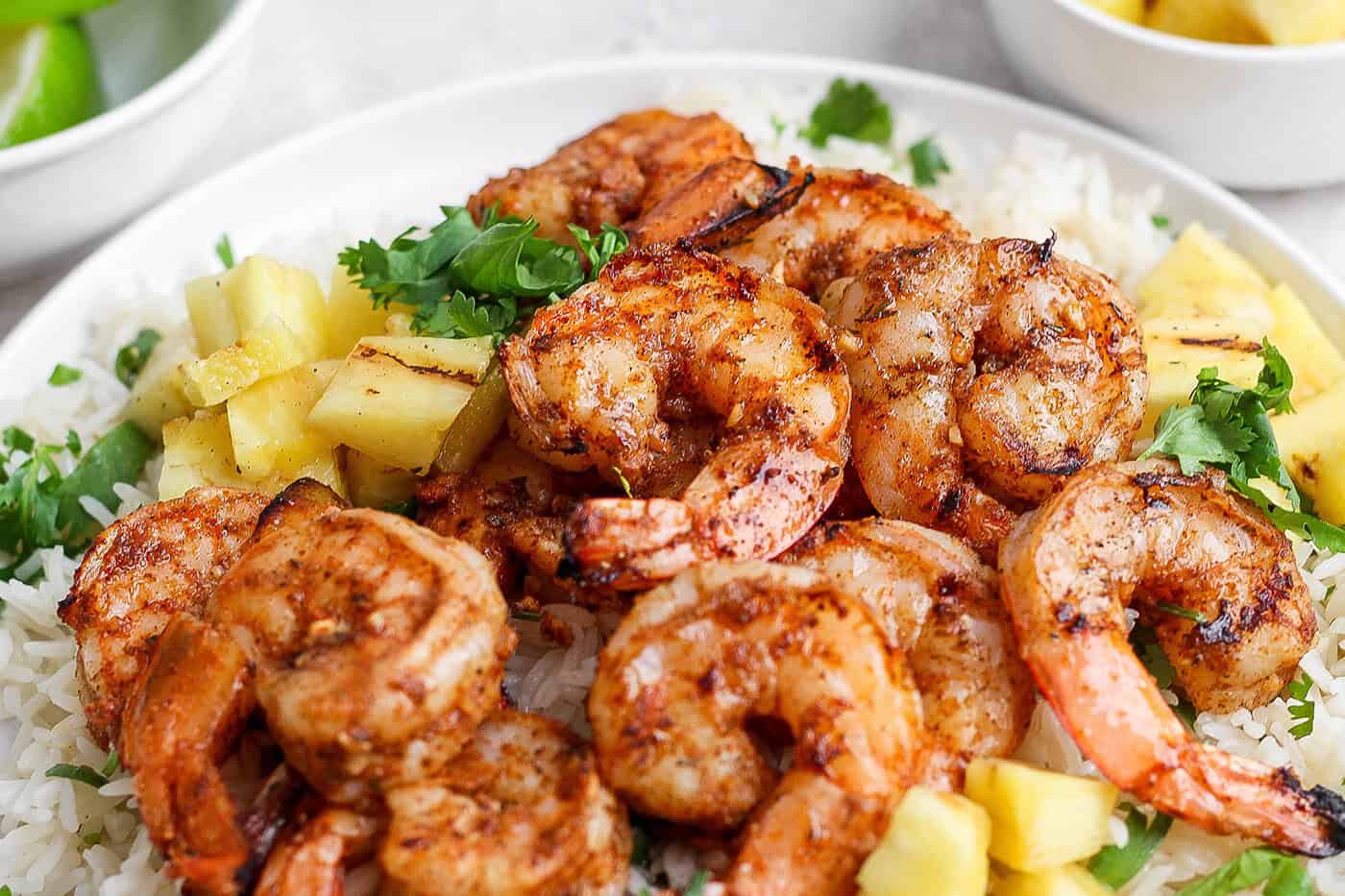 Closeup of jerk shrimp on plate of rice