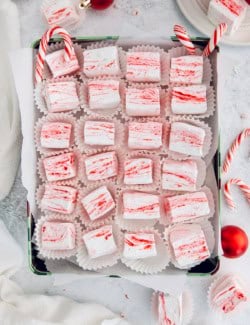 Box of homemade peppermint marshmallows in cupcake wrappers.