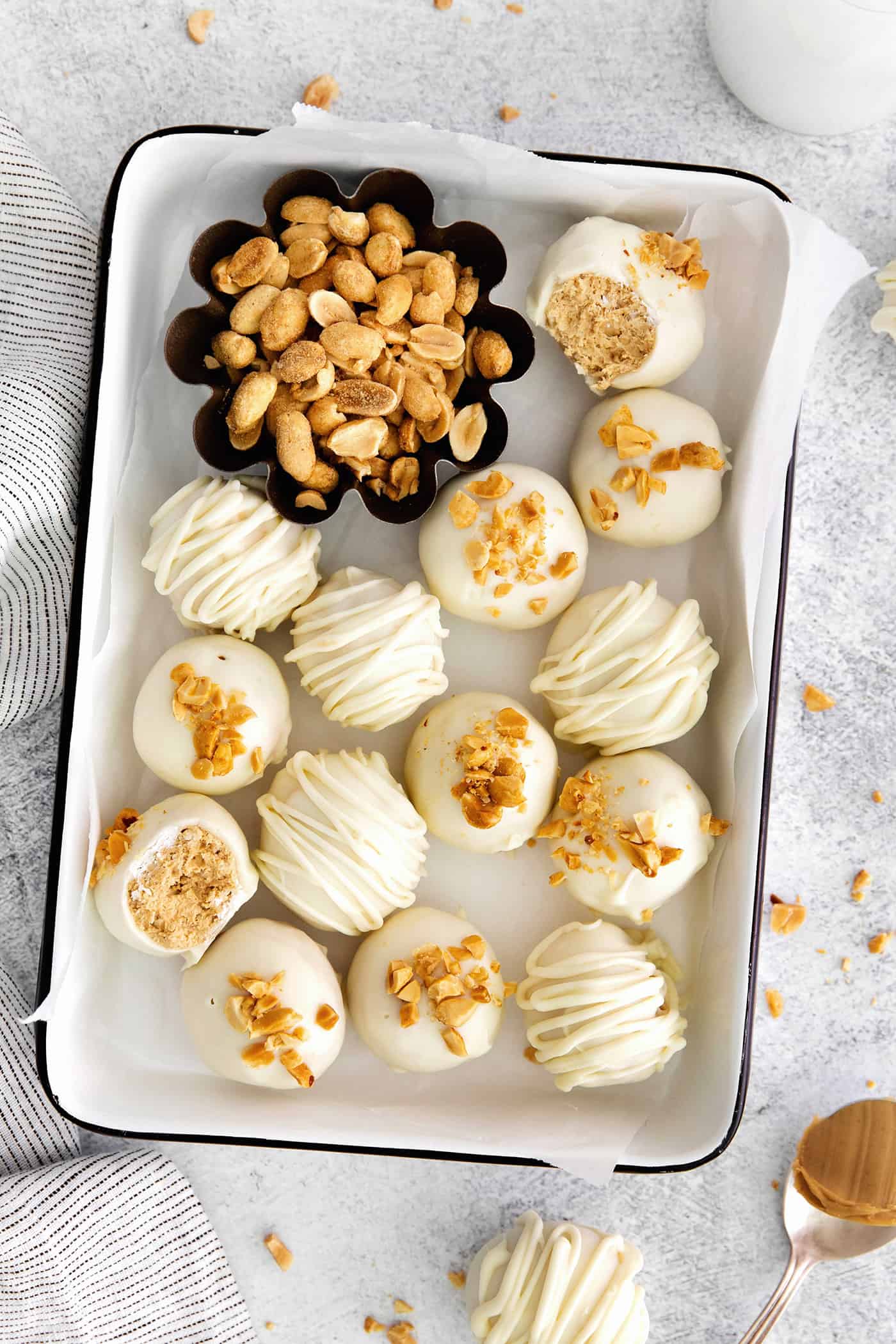 Made with just 5 ingredients, these Peanut Butter Truffles with Rice Krispies and Marshmallows are the perfect bite-sized treat. Overhead view of white chocolate peanut butter balls