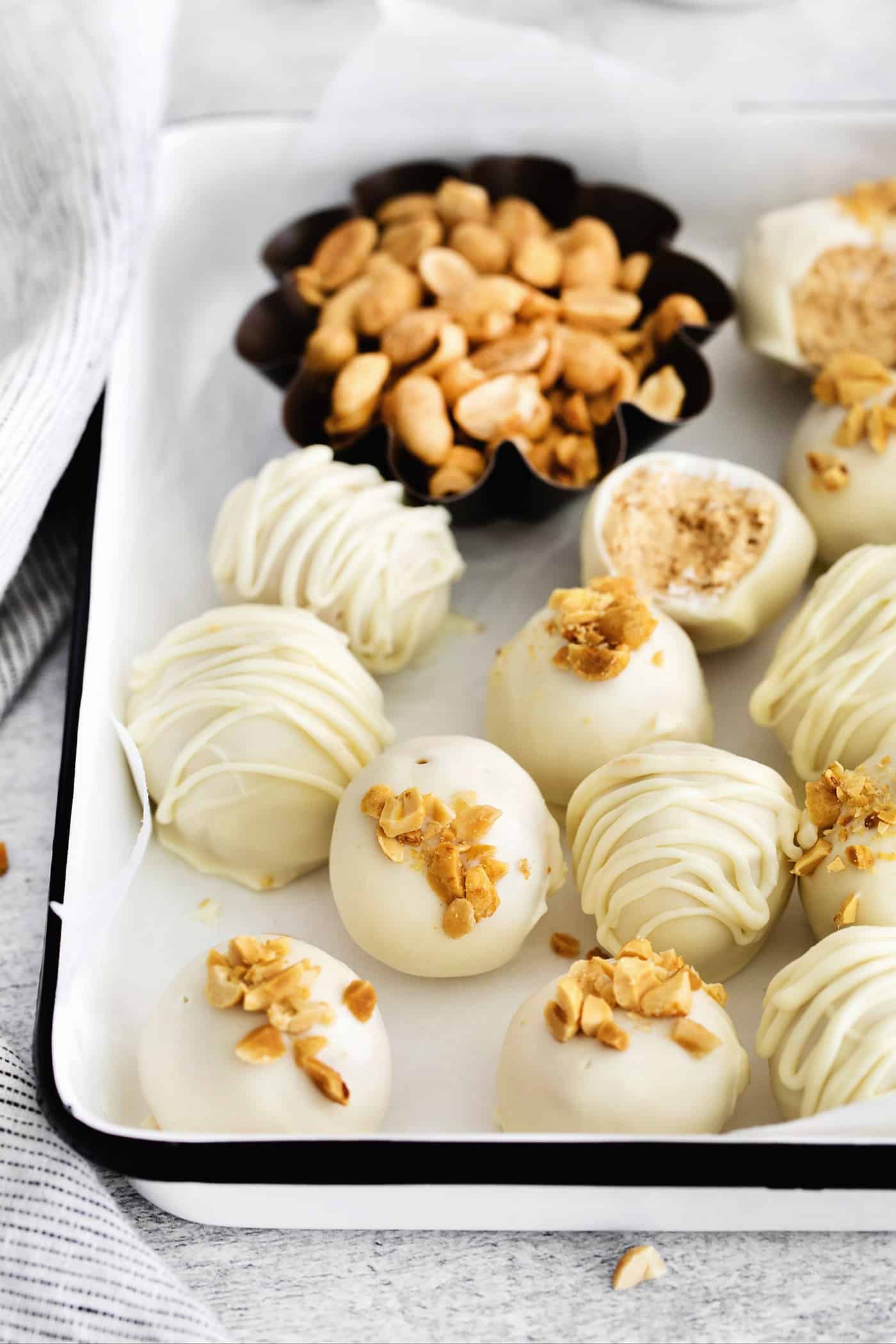 Made with just 5 ingredients, these Peanut Butter Truffles with Rice Krispies and Marshmallows are the perfect bite-sized treat. Peanut butter balls covered in white chocolate