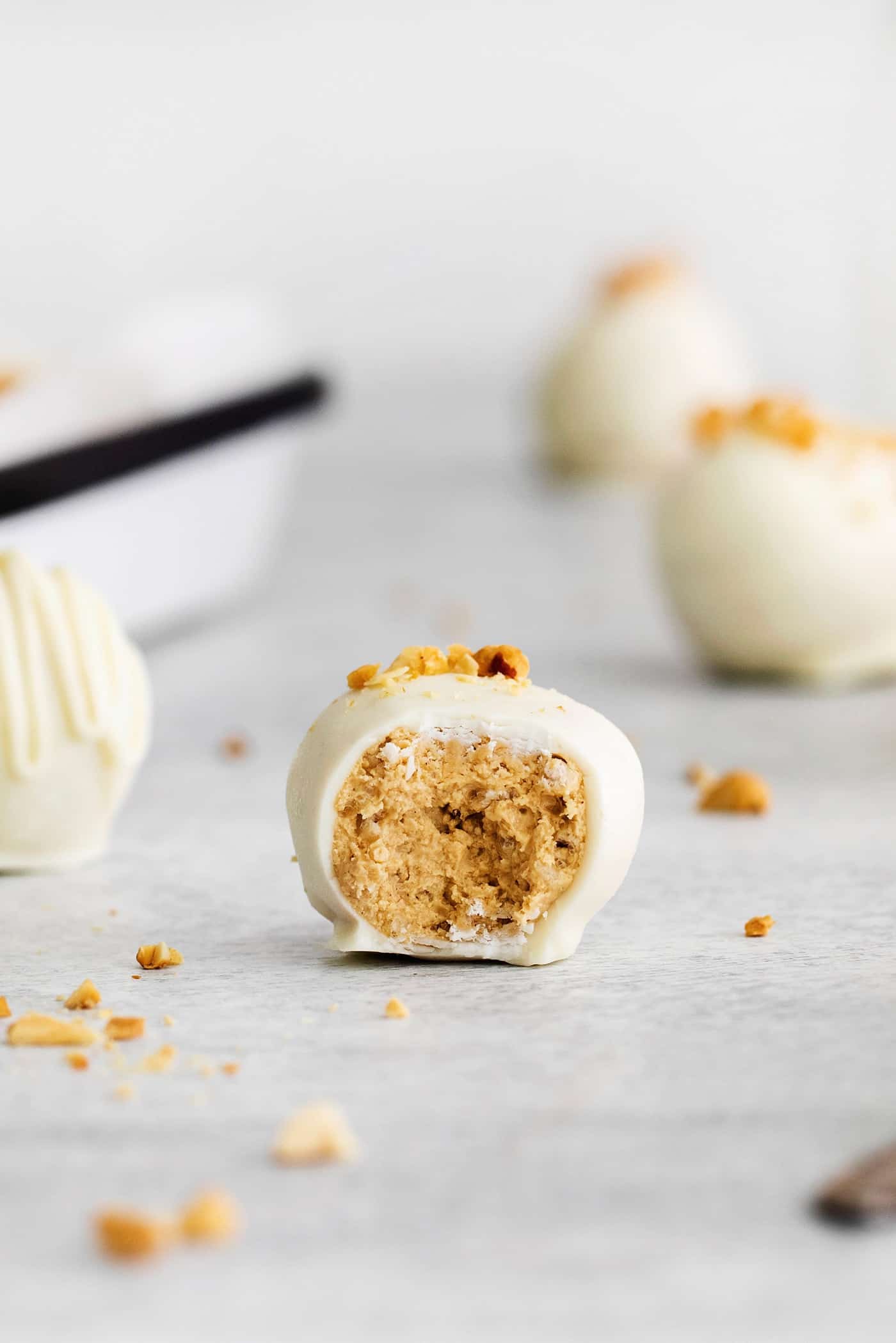 Made with just 5 ingredients, these Peanut Butter Truffles with Rice Krispies and Marshmallows are the perfect bite-sized treat. A peanut butter ball with bite missing